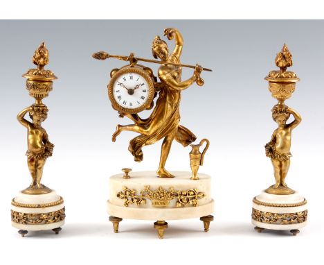 A LATE 19th CENTURY ORMOLU AND WHITE MARBLE CLOCK GARNITURE the clock formed as a dancing lady stood on oval base carrying th