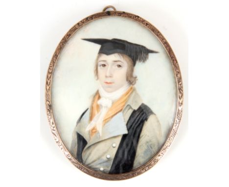 A 19th CENTURY PORTRAIT MINIATURE ON IVORY of a young scholar in gold metal engraved frame with convex glass, the reverse wit