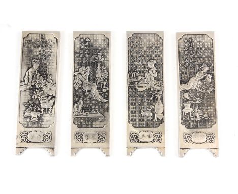 A SET OF FOUR CHINESE PAKTONG SCROLL WEIGHTS depicting ladies in garden setting 14.5cm high 4.5cm wide.