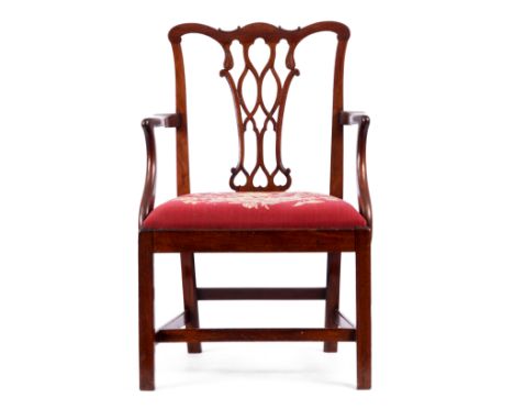 A MID 18TH CENTURY CHIPPENDALE STYLE MAHOGANY OPEN ARMCHAIR with shaped pierced 'C' scroll back and open arms, drop in tapest