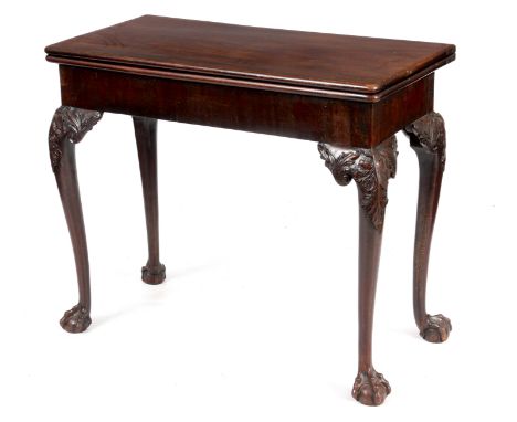 A MID 18TH CENTURY IRISH MAHOGANY FOLD OVER CARD TABLE the green baize lined playing surface with a hinged single rear gate a