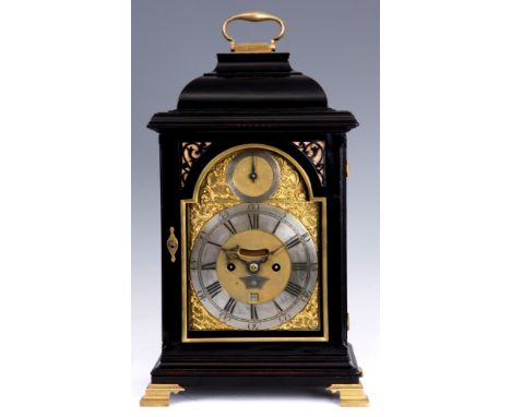 FRANCIS WELLS, LONDON A MID 18TH CENTURY EBONISED INVERTED BELL TOP VERGE BRACKET CLOCK with folding brass handle above an in