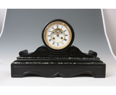 A LATE 19th CENTURY BLACK SLATE MANTEL CLOCK with shaped plinth base having green veined marble mouldings below a scrolled su