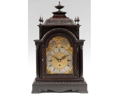 A LATE 19th CENTURY TRIPLE FUSEE EIGHT BELL BRACKET CLOCK the dark mahogany case with carved tile worked pediment above a car