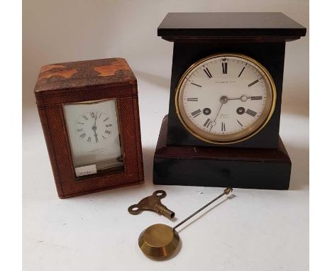 A 19th century brass cased travelling timepiece in shaped case and with white enamel dial inscribed "Examined by John Barker 