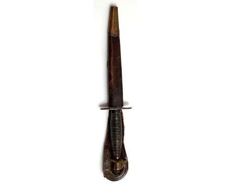 A FS fighting knife with grooved metal grip cast with cross keys near the guard and in original leather scabbard overall 29.5