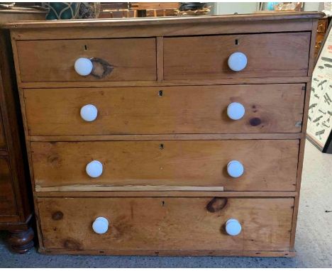 A Victorian pine chest of drawers, with white ceramic handles, 84cm high, 94cm long, 42cm deep 