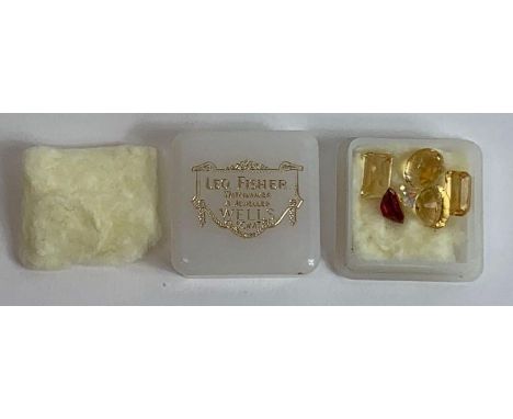 A pair of oval native cut citrines; a pair of native cut rectangular citrines; an oval cut synthetic ruby; and a paste stone