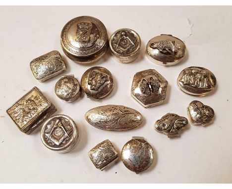 A collection of fifteen silver, silver coloured and white metal boxes, the covers embossed and set in various ways, including