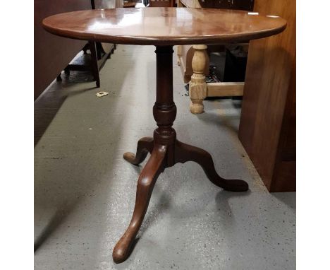 A 19th century mahogany tilt top table, standing on a tripod base, 70cm high, 75cm diameter 