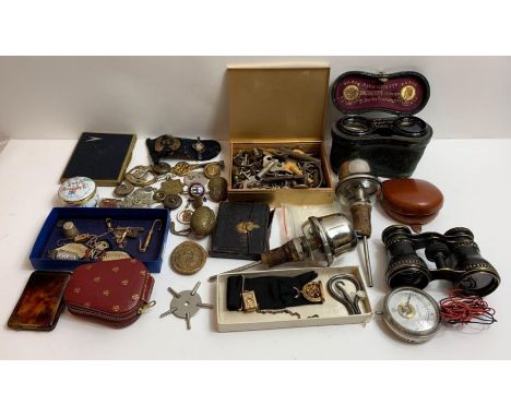 A mixed quantity of collectables including military badges, buttons, opera glasses, Victorian photographic portrait in leathe