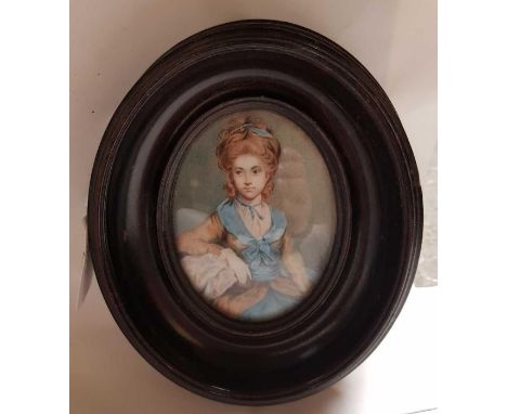 An early 19th century portrait miniature of a female, painted on ivory in an oval frame, 9cm x 6.5cm 