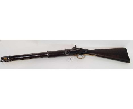 An Enfield percussion carbine, Indian army issue, with attached metal ram rod, stamped Enfield 1863 to lock, with brass trigg