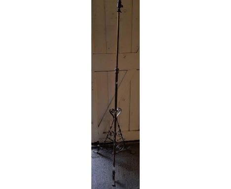 A telescopic brass standard lamp, on tripod base in traditional form, 178.3cm high fully extended including fitting