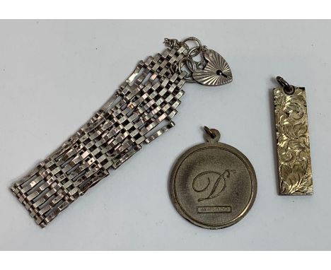 A silver gate bracelet; and a silver ingot pendant and a Yorkshire Rose pendant, 52 grams gross