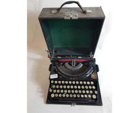 An Imperial black typewriter, cased , along with a Singer sewing machine 