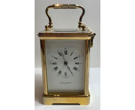 A late 20th century brass 2 train carriage clock striking on bell retailers name on white enamel dial, Bracher &amp; Sydenham