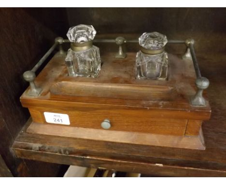Early 20th century oak formed ink stand with two fitted associated glass inkwells with brass galleried back, single drawer, b