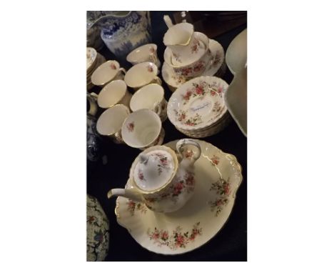 Royal Albert Lavender Rose tea set, comprising a small teapot, cream jug, sugar basin, seven tea cups and saucers and side pl