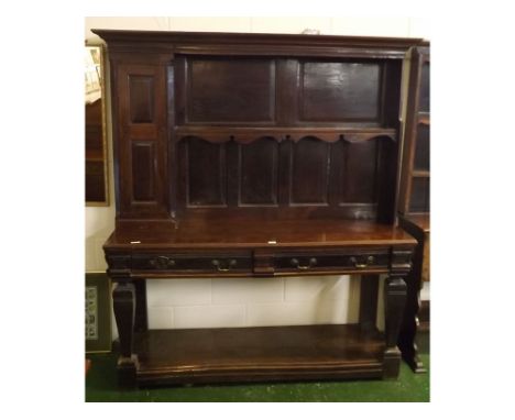 Late 18th/early 19th century oak dresser, top fitted with single shelf with panelled back, shaped frieze, single two panelled