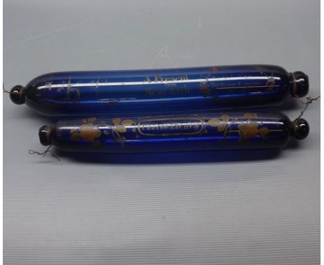 Victorian blue glass rolling pin with painted decoration "A present from Newcastle" together with a further smaller example w