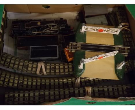 Box containing 00 gauge electric train set to include engine, assorted tenders and carriages, tin plate level crossing and mi