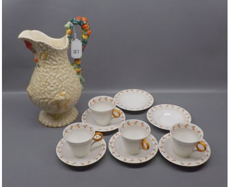 Clarice Cliff Harvest jug with fruit handle, some damage, together with six Shelley Autumn Leaf decorated saucers and four ma