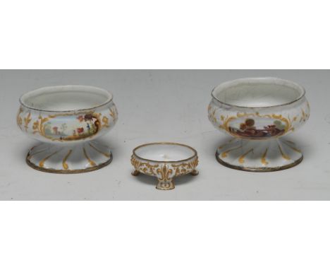 A pair of South Staffordshire enamel  pedestal salts, enamelled with rural scenes within raised scroll cartouches, spiralled 