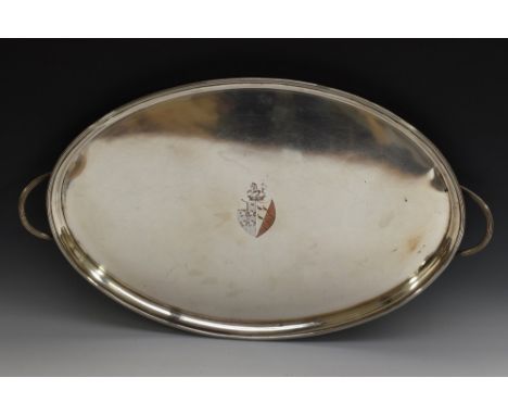 A George III Old Sheffield Plate oval twin-handled tray, centred by a bright engraved coat of arms, crested by a coronet and 