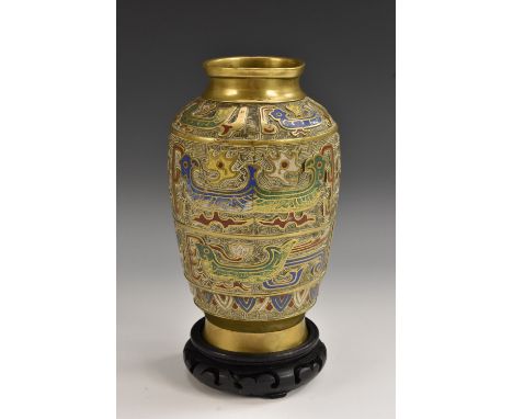 A 19th century Chinese gilt patinated bronze and champleve enamel ovoid vase, decorated in colourful polychrome with stylized