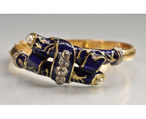 An enamelled diamond and mabe pearl hinge bangle, deep blue enamelled arched two section bound ribbon crest, inset with a gra