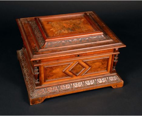 A 19th century walnut and marquetry table-top polyphon, the horizontal mechanism playing 40cm discs, hinged cover with monoch