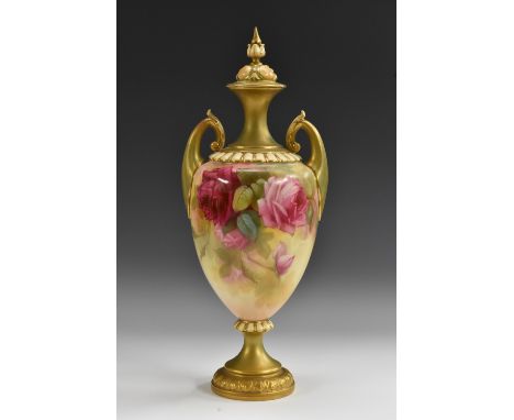 A Royal Worcester two handled pedestal ovoid vase, decorated with red and pink cabbage roses, burnished gilt handles, neck an