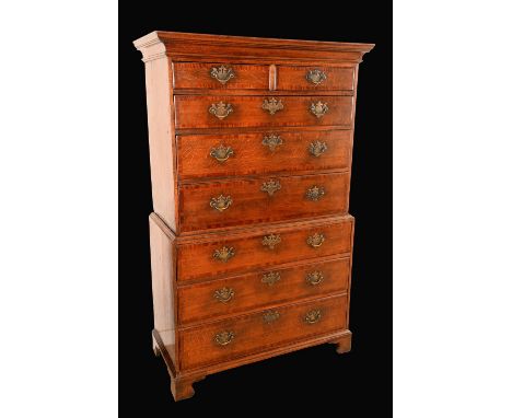 A George III mahogany crossbanded oak chest on chest, moulded cornice above two short and three long graduated drawers, the p