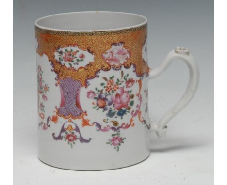 An 18th century Chinese Export famille rose porcelain cylinder mug, painted with a vase of flowers and floral sprays in tones