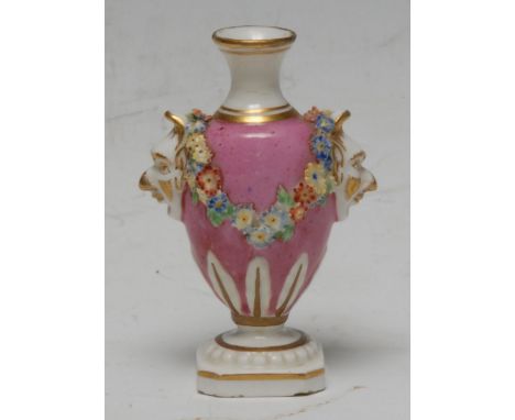 A Derby Patch Mark miniature vase, applied with floral swags on a pink ground, masks handles, canted square base, outlined in