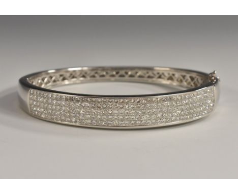 A contemporary square princess cut diamond panelled hinge bangle, Checkerboard crest inset with five rows of forty square pri