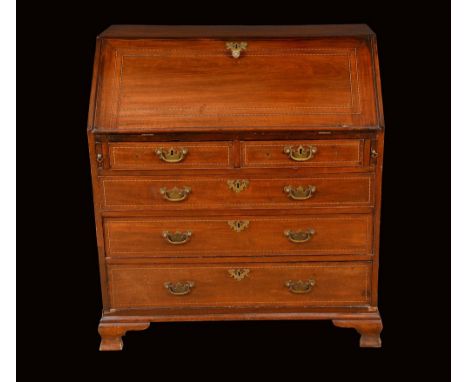 A George III mahogany bureau, fall front enclosing a swept interior with central cupboard, secret compartments, pigeon holes 
