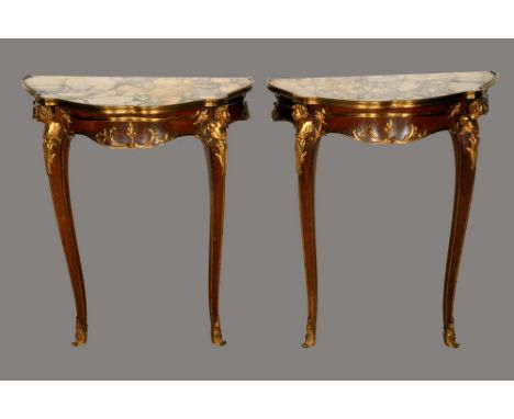 A pair of Louis XV style gilt metal mounted mahogany console tables, of small proportions, each with Breccia marble top above