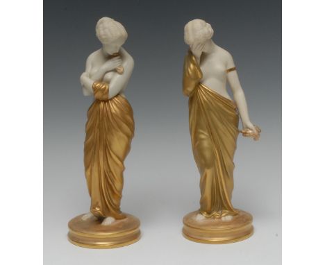 A pair of  Royal Worcester figures, Joy and Sorrow, the classical maidens stands, semi-nude, one with her face buried in her 