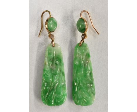 A pair of carved jade and diamond panel drop earrings, principle tapering panel carved with fruiting vines, suspended from a 