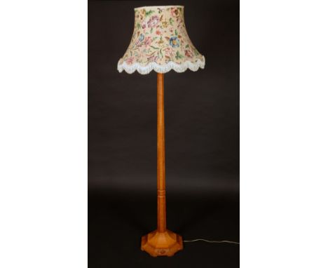 Robert Thompson, Mouseman of Kilburn - an oak standard lamp, spreading octagonal column and base, adzed overall, carved mouse