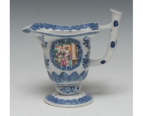 An 18th century Chinese Export porcelain helmet-shaped cream jug, painted in polychrome with traditional figures in a garden 
