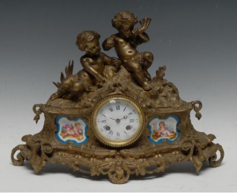 A 19th century French gilt-metal and porcelain mounted mantel clock, 6cm enamel dial inscribed with Roman and Arabic numerals