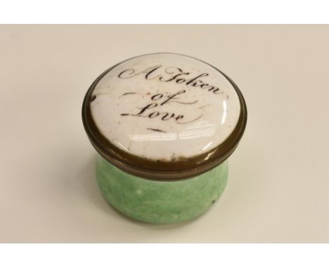 A George III South Staffordshire enamel circular pill box, the slightly domed cover inscribed A token of Love, apple green ba