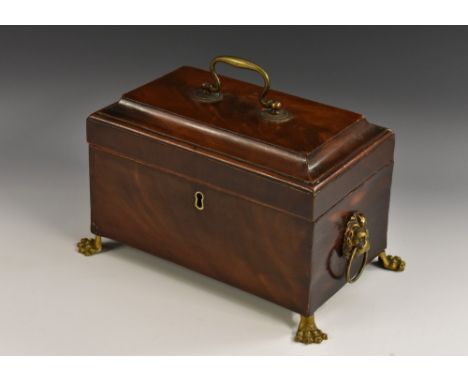 A George III mahogany rectangular tea caddy, hinged cover with brass swan neck handle, enclosing a pair of lidded compartment