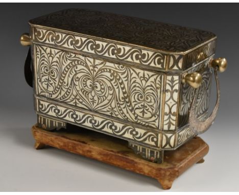 An unusually large 19th century Maranao silver damascened brass betel box, decorated in the Islamic taste, hinged cover enclo