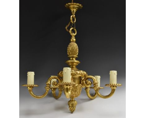 A George I style gilt-metal five-branch electrolier chandelier, pineapple crested campana urn cast with an egg frieze above s