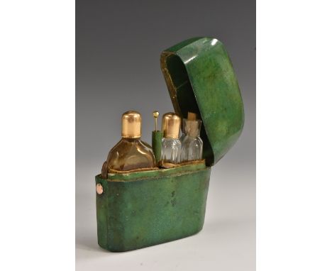 An 18th century lady's shagreen rounded square scent etui, the hinged cover enclosing three graduating scent phials, two of w