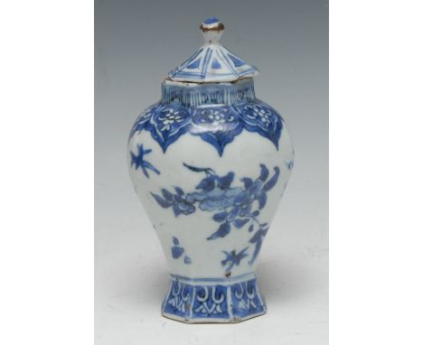 An early 18th century Chinese porcelain lobed octofoil vase and cover, painted in underglaze blue with the Three Friends of W